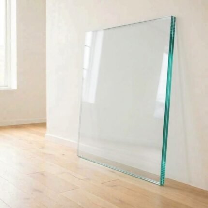 21.52mm toughened laminated clear glass panel cut to size, showing the interlayer at the polished edge, leaning against a white wall