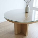 Round clear toughened glass table top on a round oak table